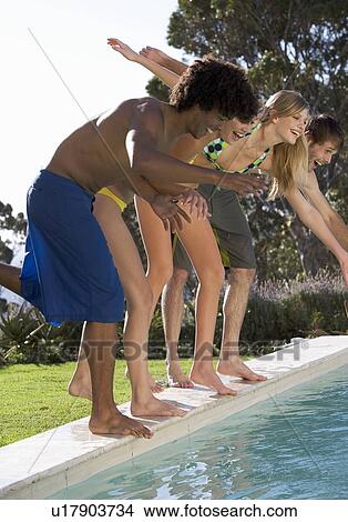 Four teenage friends having fun in a swimming pool View Large Photo Image Picture - Four teenage friends having fun in a swimming pool. Fotosearch