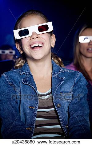 Girl at the cinema watching a film through 3-D glasses View Large Photo Image Stock Image - Girl at the cinema watching a film through 3-D glasses. Fotosearch