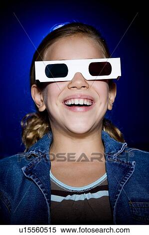 Girl at the cinema watching a film through 3-D glasses View Large Photo Image Stock Photography - Girl at the cinema watching a film through 3-D glasses. Fotosearch