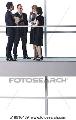 Stock Photo - Group of business colleagues in modern office building. Fotosearch