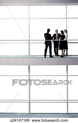 Group of business colleagues in modern office building View Large Photo Image Stock Photo - Group of business colleagues in modern office building. Fotosearch