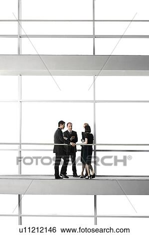 Group of business colleagues in modern office building View Large Photo Image Stock Photograph - Group of business colleagues in modern office building. Fotosearch