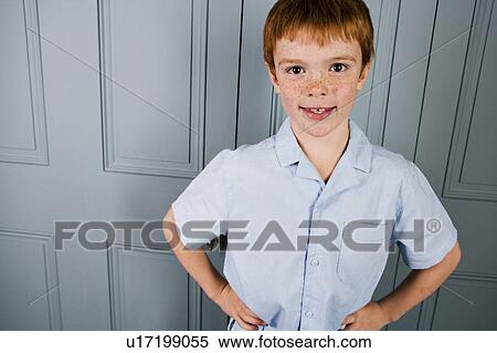 Stock Photography - Indoor portrait boy with ginger hair. Fotosearch