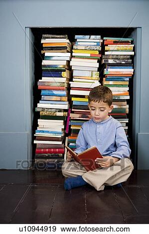 little boy reading on the floor View Large Photo Image Stock Photo - little boy reading on the floor. Fotosearch
