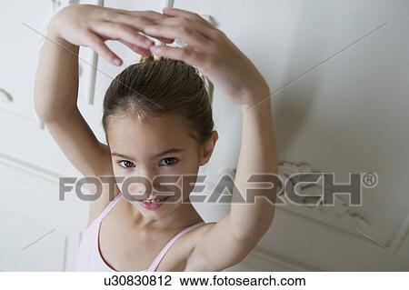 Little girl in a ballet pose View Large Photo Image Stock Image - Little girl in a ballet pose . Fotosearch