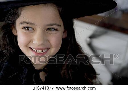 Little girl in a witch's costume for Halloween View Large Photo Image Stock Photo - Little girl in a witch's costume for Halloween . Fotosearch