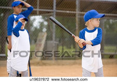 Little league baseball game boy about to bat View Large Photo Image Stock Image - Little league baseball game boy about to bat. Fotosearch