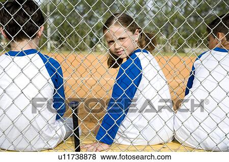 Little league baseball players sitting on bench View Large Photo Image Stock Photo - Little league baseball players sitting on bench. Fotosearch