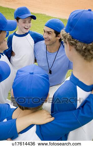 Little league baseball team in huddle with their coach View Large Photo Image Stock Photograph - Little league baseball team in huddle with their coach. Fotosearch