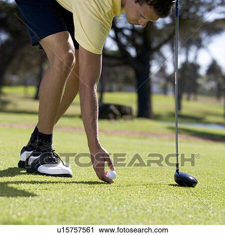 Man playing golf, close-up View Large Photo Image Stock Image - Man playing golf, close-up. Fotosearch