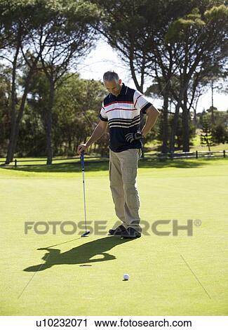 Man playing golf View Large Photo Image Stock Image - Man playing golf. Fotosearch