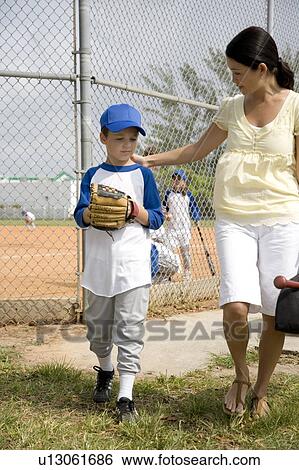 Mother encouraging son at baseball game View Large Photo Image Stock Photograph - Mother encouraging son at baseball game. Fotosearch