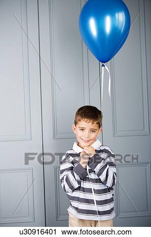 portrait boy holding balloon View Large Photo Image Stock Image - portrait boy holding balloon . Fotosearch