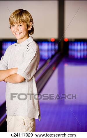 Portrait of a boy in a bowling alley View Large Photo Image Stock Photo - Portrait of a boy in a bowling alley. Fotosearch