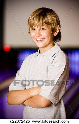 Portrait of a boy in a bowling alley View Large Photo Image Stock Photography - Portrait of a boy in a bowling alley. Fotosearch