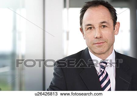 Portrait of a businessman in a suit View Large Photo Image Stock Image - Portrait of a businessman in a suit. Fotosearch