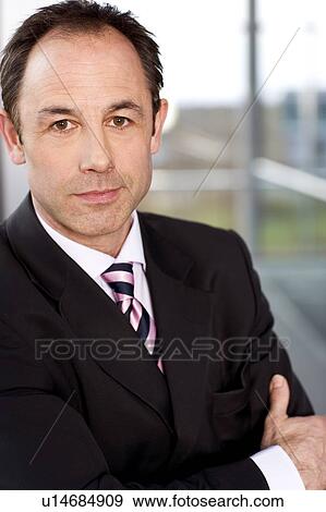 Stock Photo - Portrait of a businessman in a suit. Fotosearch