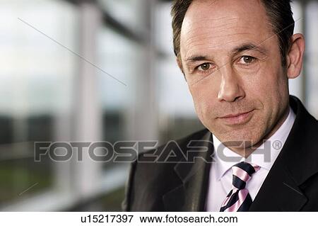 Portrait of a businessman in a suit View Large Photo Image Stock Photo - Portrait of a businessman in a suit. Fotosearch