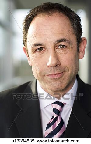 Portrait of a businessman in a suit View Large Photo Image Stock Photography - Portrait of a businessman in a suit . Fotosearch