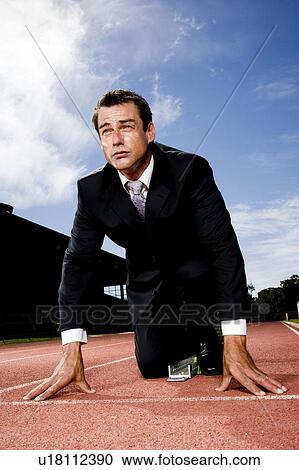 Portrait of a businessman on the starting blocks View Large Photo Image Stock Image - Portrait of a businessman on the starting blocks . Fotosearch