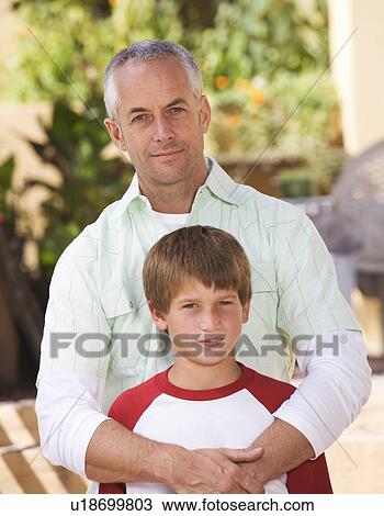 Stock Image - Portrait of a father with his young son. Fotosearch