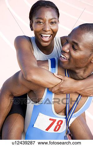 Portrait of a female and athletes celebrating their win View Large Photo Image Stock Photo - Portrait of a female and athletes celebrating their win. Fotosearch