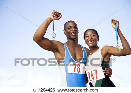 Portrait of a female and athletes with their medals View Large Photo Image Stock Photograph - Portrait of a female and athletes with their medals. Fotosearch