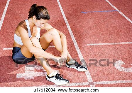 Picture - Portrait of a female athlete resting. Fotosearch