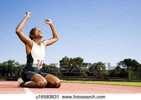 Portrait of a female athlete celebrating her win View Large Photo Image Stock Image - Portrait of a female athlete celebrating her win. Fotosearch
