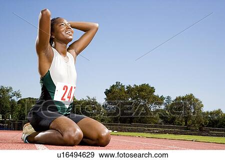 Portrait of a female athlete celebrating her win View Large Photo Image Stock Photo - Portrait of a female athlete celebrating her win. Fotosearch