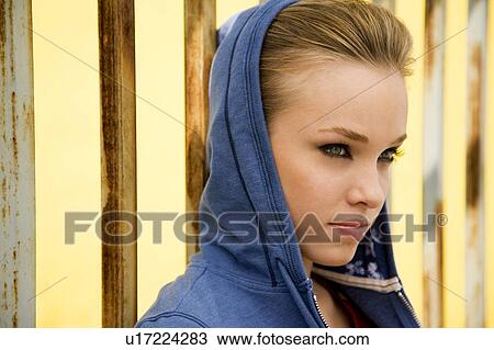 Portrait of a girl leaning against railing bars View Large Photo Image Stock Image - Portrait of a girl leaning against railing bars. Fotosearch