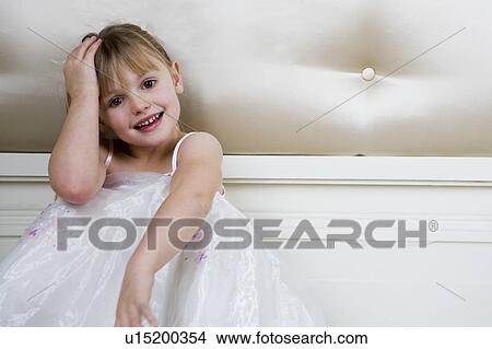 Picture - Portrait of a little girl in party dress . Fotosearch