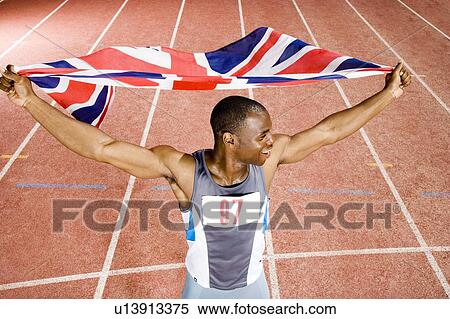 Stock Photography - Portrait of a male athlete with UK flag. Fotosearch