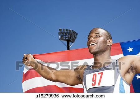 Portrait of a male athlete with US flag View Large Photo Image Stock Photograph - Portrait of a male athlete with US flag. Fotosearch