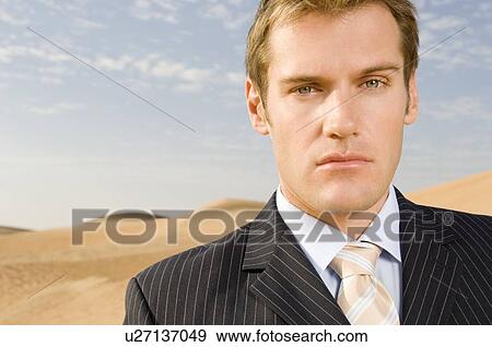Stock Photo - Portrait of a man in a suit. Fotosearch