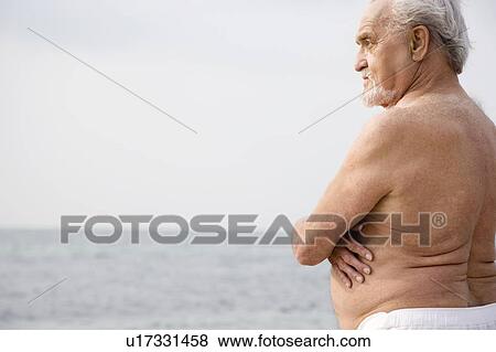 Portrait of a senior man looking out to sea View Large Photo Image Stock Photo - Portrait of a senior man looking out to sea. Fotosearch
