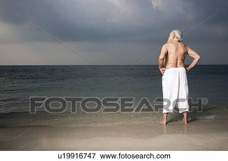 Portrait of a senior man looking out to sea View Large Photo Image Stock Photo - Portrait of a senior man looking out to sea. Fotosearch