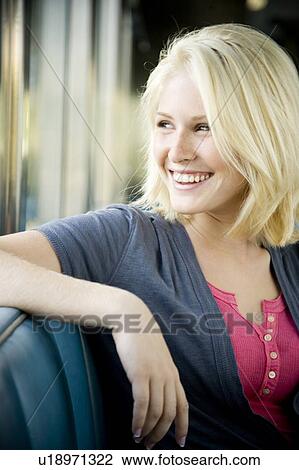 Stock Image - Portrait of a teenage girl hanging out at a diner. Fotosearch