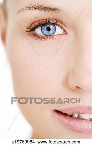 Picture - Portrait of a young blond woman, close-up of right side of face. Fotosearch