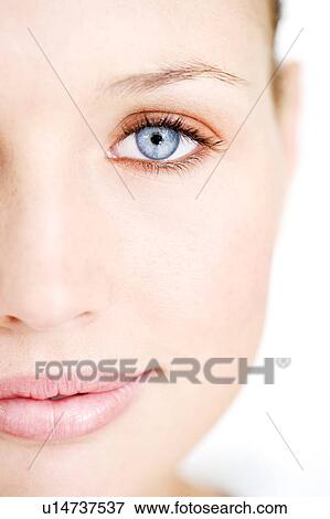 Portrait of a young blond woman, close-up of left side of face View Large Photo Image Stock Photo - Portrait of a young blond woman, close-up of left side of face. Fotosearch