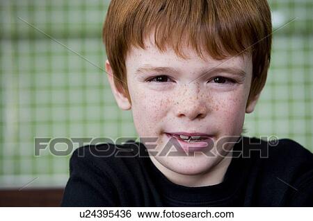 Stock Photograph - Portrait of a young boy dressed in black. Fotosearch