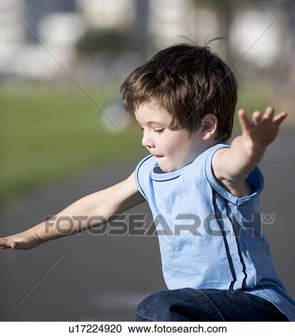 Stock Image - Portrait of a young boy. Fotosearch