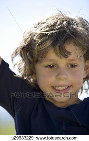 Portrait of a young boy View Large Photo Image Stock Photo - Portrait of a young boy. Fotosearch