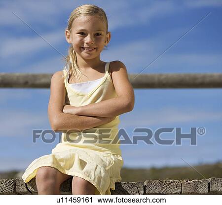 Portrait of a young girl View Large Photo Image Stock Image - Portrait of a young girl. Fotosearch