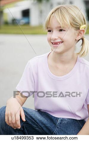 Portrait of a young girl View Large Photo Image Stock Image - Portrait of a young girl. Fotosearch