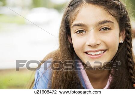 Portrait of a young girl View Large Photo Image Stock Image - Portrait of a young girl. Fotosearch