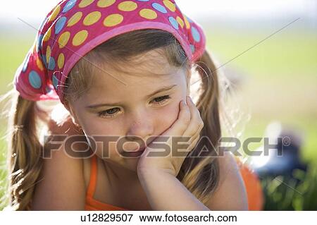 Portrait of a young girl View Large Photo Image Stock Photo - Portrait of a young girl. Fotosearch