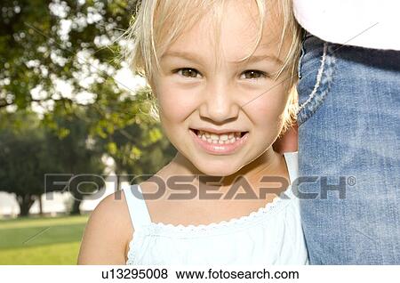 Portrait of a young girl View Large Photo Image Stock Photo - Portrait of a young girl. Fotosearch