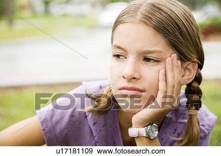 Portrait of a young girl View Large Photo Image Stock Photo - Portrait of a young girl. Fotosearch