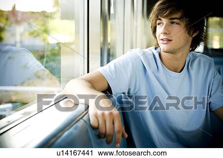 Portrait of a young man hanging out at a diner. View Large Photo Image Stock Image - Portrait of a young man hanging out at a diner. . Fotosearch